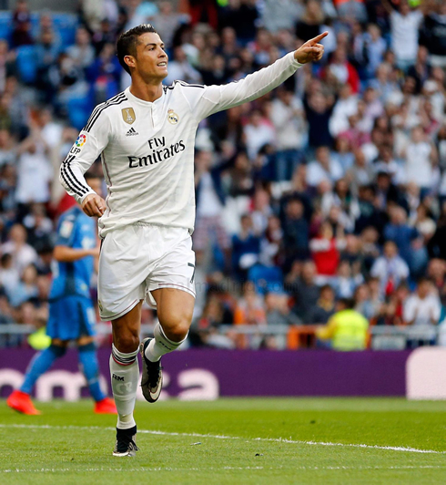 Cristiano Ronaldo pointing to his teammates after scoring a goal for Real Madrid in La Liga 2014-2015
