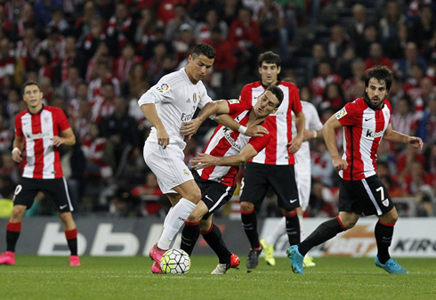 Cristiano Ronaldo surrounded by several Athletic Bilbao players