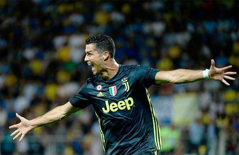 Cristiano Ronaldo opens his arms to celebrate his goal for Juventus in 2018