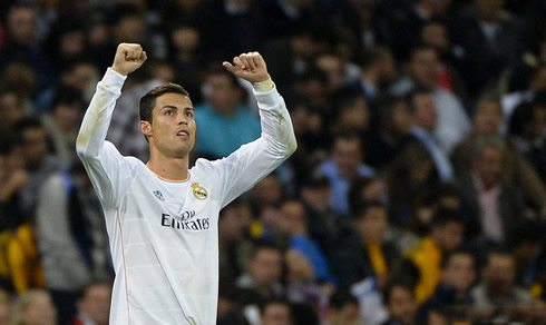 Cristiano Ronaldo raising his two arms as a winner, in Real Madrid vs Juventus