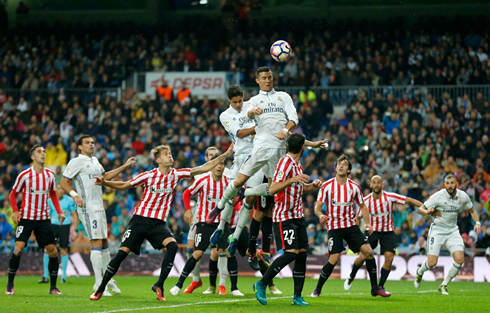 Cristiano Ronaldo rising high in the air to head a ball coming from a corner-kick