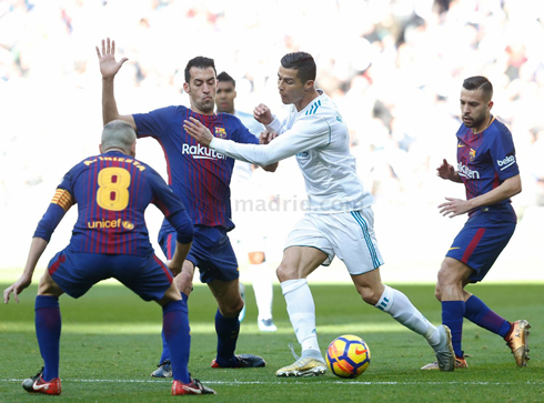 Cristiano Ronaldo surrounded by Barcelona players in El Clasico in 2017