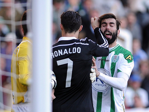 Cristiano Ronaldo punching an opponent, in Cordoba vs Real Madrid