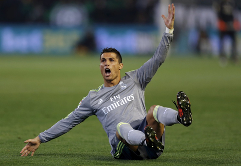 Cristiano Ronaldo on the ground and shouting at the referee