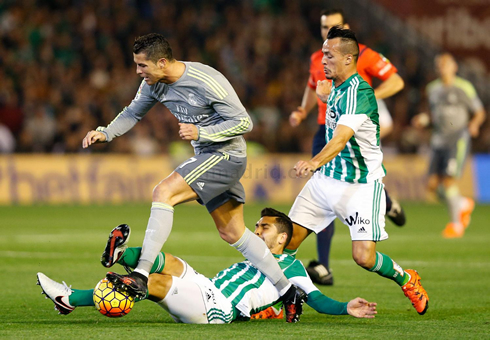 Cristiano Ronaldo gets tackled by a defender in Betis 1-1 Real Madrid