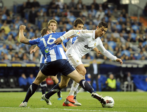 Cristiano Ronaldo gets around a defender in a Real Madrid game against Real Sociedad