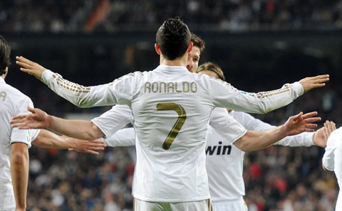Cristiano Ronaldo about to hug Xabi Alonso in Real Madrid goal celebrations, in 2012