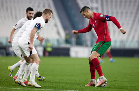 Cristiano Ronaldo trying to dribble several opponents at once