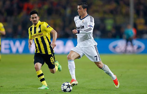 Cristiano Ronaldo running with the ball next to Gundogan, in Borussia Dortmund vs Real Madrid for the Champions League 2013