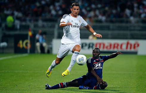 Cristiano Ronaldo jumping over a defender making a sliding tackle, in Lyon 2-2 Real Madrid, in the 2013-2014 pre-season