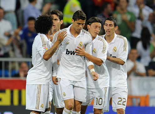 Cristiano Ronaldo being congratulated by Marcelo, Kaká, Ozil and Angel Di María in Spanish League fixture: Real Madrid vs Rayo Vallecano 2011-2012