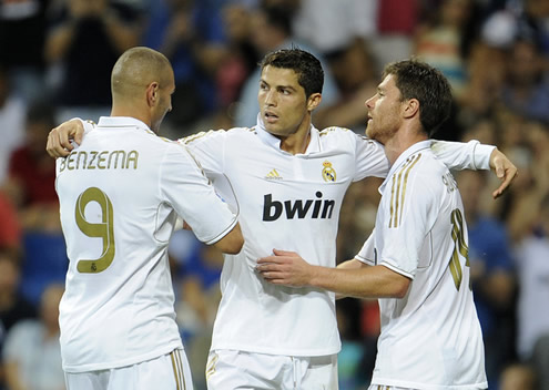 Cristiano Ronaldo hugging Benzema and Xabo Alonso when celebrating another Real Madrid goal in La Liga 2011-2012