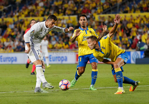 Ronaldo shooting the ball already inside Las Palmas box, with an opponent throwing himself in front