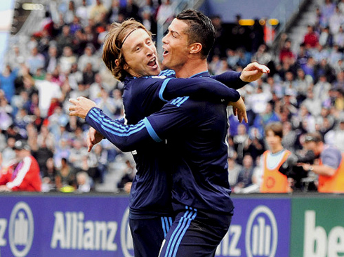 Cristiano Ronaldo and Luka Modric hugging and holding each other
