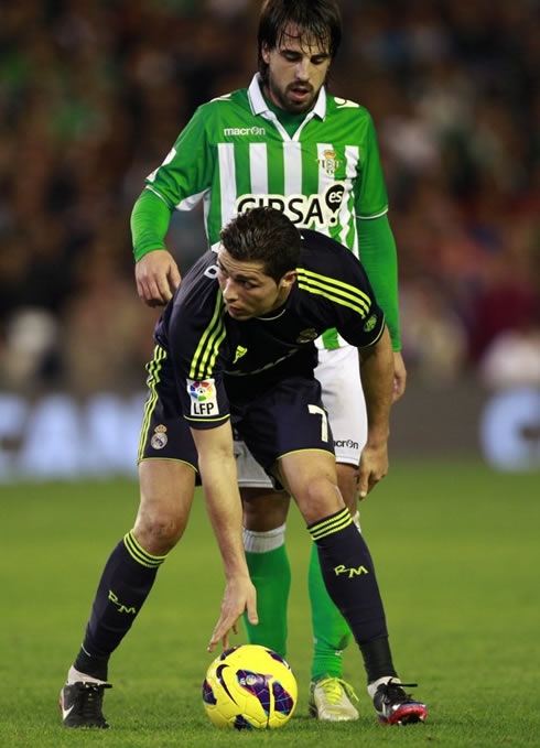 Cristiano Ronaldo in a weird pose with his back turned to Benat, in Betis vs Real Madrid for La Liga 2012-2013