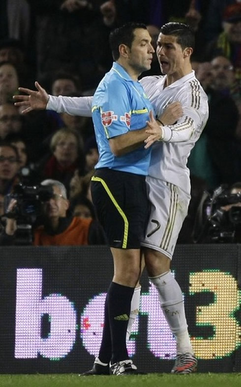 Cristiano Ronaldo close argument with the referee in the match between Barcelona and Real Madrid, that led to him seeing a yellow card