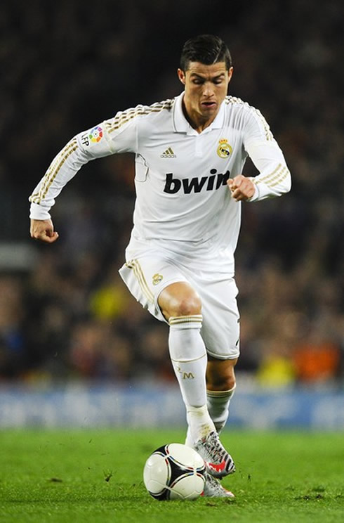 Cristiano Ronaldo running with the ball in Barcelona vs Real Madrid, for the Copa del Rey in 2012
