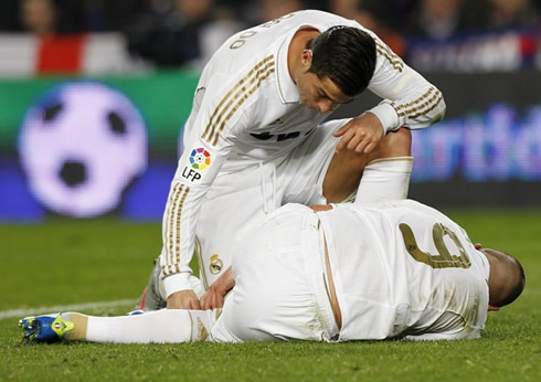 Cristiano Ronaldo checking Karim Benzema's injury and condition, in the Clasico between Real Madrid and Barcelona, for the 2nd leg of the Copa del Rey 2012