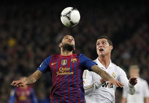 Cristiano Ronaldo looking scared while he sees Daniel Alves heading the ball in Barcelona vs Real Madrid, in 2011-2012