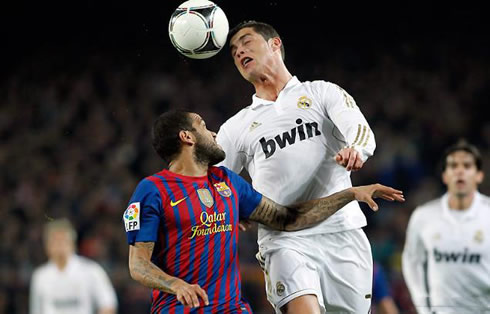 Cristiano Ronaldo jumping more than Daniel Alves to head the ball, in Barcelona vs Real Madrid 2011-2012