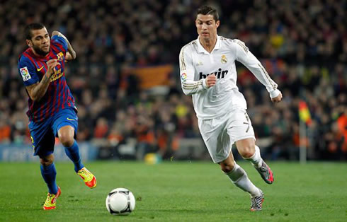 Cristiano Ronaldo running side by side with the Brazilian, Daniel Alves, in Barcelona vs Real Madrid for the Copa del Rey 2011/2012
