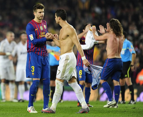 Gerard Piqué saluting and congratulating Cristiano Ronaldo, after the end of the game between Barcelona and Real Madrid, for the Copa del Rey 2012