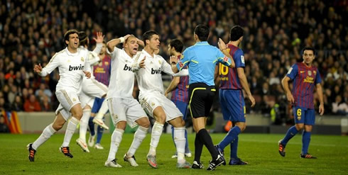 Real Madrid players, Kaká, Pepe and Cristiano Ronaldo running at the referee in the Clasico between Barcelona and Real Madrid, Copa del Rey 2011-2012