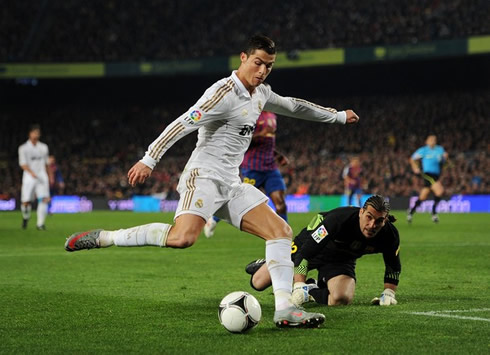 Cristiano Ronaldo scoring the first Real Madrid goal against Barcelona, after getting past Pinto, in Barça vs Real Madrid for the Copa del Rey, in 2012