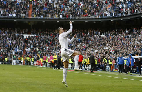 Cristiano Ronaldo preparing to jump for his goal celebration in the Santiago Bernabéu