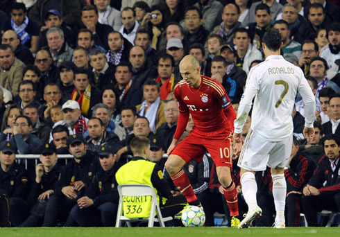 Arjen Robben preparing to take on Cristiano Ronaldo in Real Madrid vs Bayern Munich in 2012