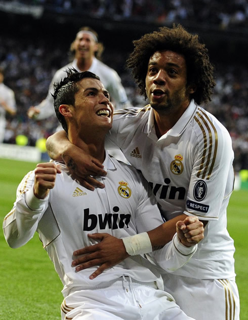 Cristiano Ronaldo smiling with Marcelo, while celebrating Real Madrid goal vs Bayern Munchen, in the UEFA Champions League 2012