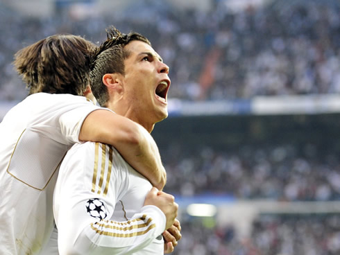Xabi Alonso hugging Cristiano Ronaldo from behind, as Real Madrid takes the lead vs Bayern Munich in 2012