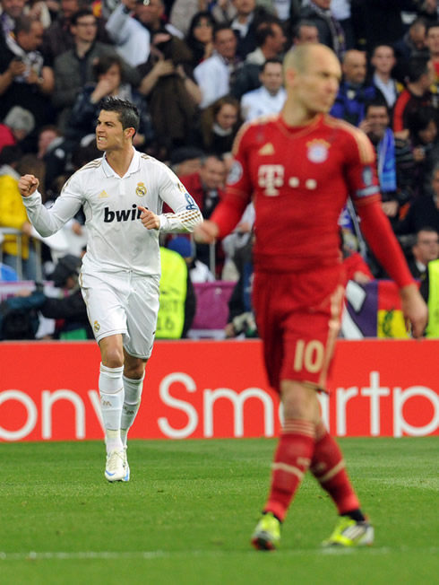 Cristiano Ronaldo clenching his teeth while celebrating goal for Real Madrid against Bayern Munich, Arjen Robben near him