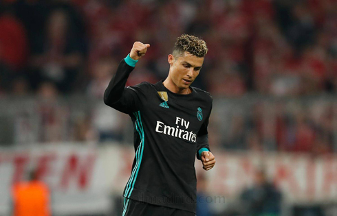 Cristiano Ronaldo celebrates a Real Madrid goal scored by a teammate
