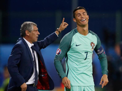 Cristiano Ronaldo smiling near Fernando Santos