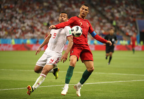 Ronaldo fights for the ball in Iran vs Portugal in 2018