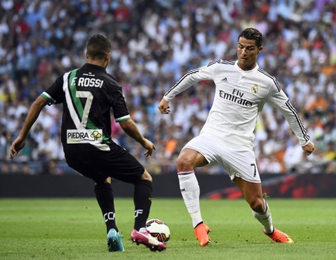 Cristiano Ronaldo using the outside of his boot to reach first on a loose ball