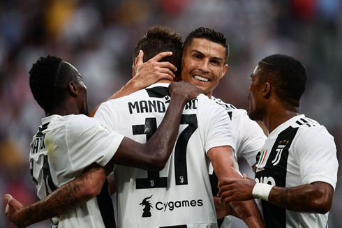 Cristiano Ronaldo celebrating a Juventus goal with this teammates