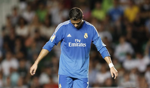 Cristiano Ronaldo looks down and shows off his frustration in a Spanish league game