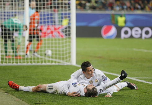 Cristiano Ronaldo shows his appreciation for Bale, hugging him while layed on the ground