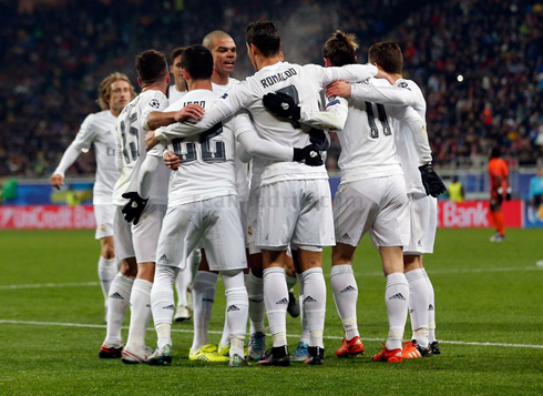 Cristiano Ronaldo hugs his Real Madrid teammates after scoring in the Champions League
