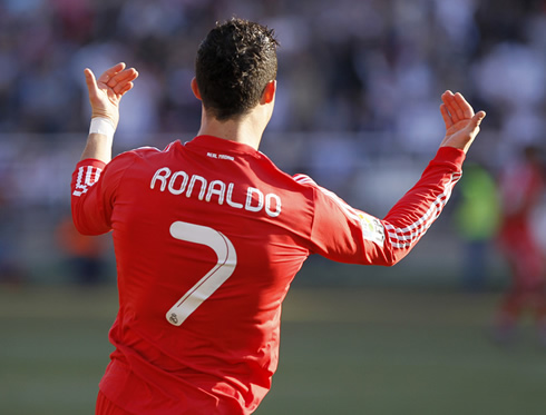 Cristiano Ronaldo running backwards and calling his Real Madrid teammates to celebrate with him