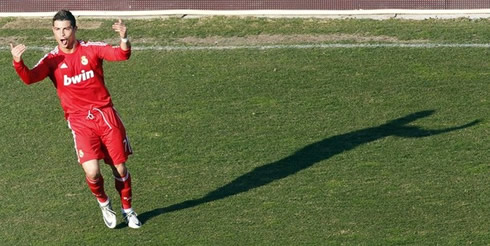 Cristiano Ronaldo celebrating his goal against Rayo Vallecano near the sideline, and waiting for his teammates to join him