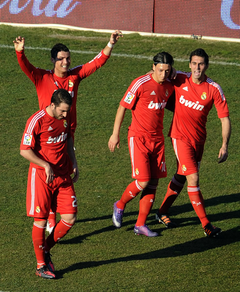 Cristiano Ronaldo making the claw fingers, with Higuaín, Ozil and Arbeloa near him