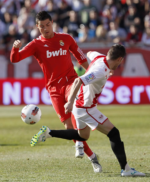 Cristiano Ronaldo getting past a Rayo Vallecano defender in a La Liga game