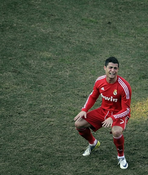 Cristiano Ronaldo in squat position, crying in Real Madrid 2012