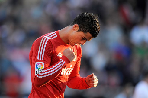 Cristiano Ronaldo looking down and celebrating a goal