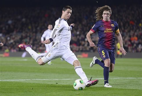 Cristiano Ronaldo and Carles Puyol during the El Clasico game between Barcelona and Real Madrid, in 2013