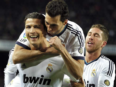 Cristiano Ronaldo holding Arbeloa on his back, as he celebrates Real Madrid goal in the Camp Nou, against Barcelona