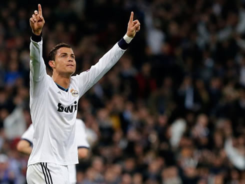 Cristiano Ronaldo lifting his two arms to the sky, as he celebrates Real Madrid goal at the Camp Nou, against Barcelona